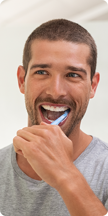 man brushing teeth